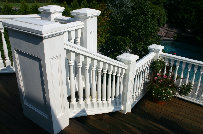 Exterior stair railing and deck with decorative balusters and newel posts